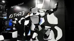 Robot humanoid generasi ketiga T-HR3 berusaha menjaga keseimbangannya saat berdiri dengan satu kaki selama Pameran Robot Internasional 2017 di Tokyo (29/11). Robot T-HR3 adalah hasil eksplorasi Toyota secara global. (AFP/Toru Yamanaka)