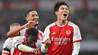 Di balik kehebatan Arsenal asuhan Mikel Arteta dalam beberapa musim terakhir di Liga Inggris, terdapat sosok pesepak bola asal Jepang, Takehiro Tomiyasu yang manjadi andalan di lini belakang The Gunners. Jauh sebelum memutuskan hijrah ke Eropa, pesepak bola kelahiran Fukuoka 25 tahun lalu ini merupakan alumnus J.League bersama Avispa Fukuoka. (AFP/Glyn Kirk)