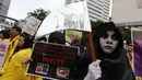 Salah satu aksi mahasiswa UI,  Fakultas Kesehatan Masyarakat, di Bundaran HI, Jakarta, Minggu (30/11/2014). (Liputan6.com/Faizal Fanani) 