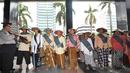 Para petani perempuan itu menyampaikan aspirasinya melalui lagu berbahasa Jawa, Jakarta, Kamis (22/11/2014). (Liputan6.com/Miftahul Hayat)