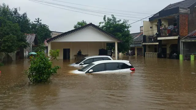 Banjir melanda Pondok Hijau, Kelurahan Pengasinan, Bekasi Timur, Rabu (1/1/2020) (Liputan6.com/ Fachrur Rozie)