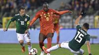 Romelu Lukaku (tengah) cetak dua gol saat Belgia diimbangi Meksiko (JOHN THYS / AFP)