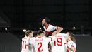 Para pemain Turki merayakan kemenangan atas Belanda pada laga kualifikasi Piala Dunia 2022 di Stadion Olimpiade Ataturk, Kamis (25/3/2021). Turki menang dengan skor 4-2. (Murad Sezer/Pool Photo via AP)