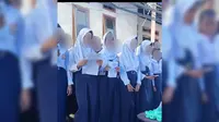 Sebuah video yang memperlihatkan sejumlah siswi berhijab menyanyikan lagu rohani viral di berbagai platform media sosial. (Liputan6.com/Fauzan)