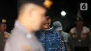 Wali Kota Madiun, Maidi saat tiba di Gedung Merah Putih Komisi Pemberantasan Komisi Pemberantasan Korupsi (KPK), Jakarta, Senin (19/1/2026). Wali Kota Madiun, Maidi, terjaring Operasi Tangkap Tangan (OTT) Komisi Pemberantasan Korupsi (KPK) pada Senin 19 Januari 2026. (Liputan6.com/Helmi Fithriansyah)