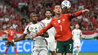 Cristiano Ronaldo (kanan) saat Timnas Portugal kalahkan Hungaria. (Attila KISBENEDEK / AFP)