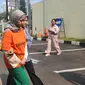 Tersangka kekerasan anak, Meita Irianty saat dibawa ke Polres Metro Depok. (Liputan6.com/Dicky Agung Prihanto).