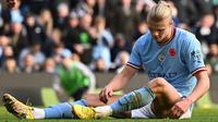 Striker Man City, Erling Haaland tampak kecewa saat timnya dikalahkan Brentford dengan skor 1-2 pada lanjutan Liga Inggris 2022/2023 hari Sabtu (12/11/2022). (OLI SCARFF / AFP)