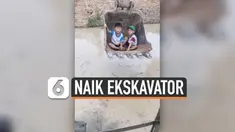Ide cemerlang seorang bapak membawa 2 anaknya menggunakan ekskavator melintasi banjir di Vietnam. Ia membantu anak-anaknya agar sampai dengan selamat tiba di sekolah.
