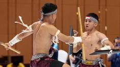 Atlet Kun Bokator putra Indonesia, Gema Nur Arifin dan Yazid Hanifam Kurniawan, bertanding dalam nomor Men's Duo Group Performance Kun Bokator SEA Games 2023 di Chrouy Changvar Convention Center, Phnom Penh, Kamboja, Senin (8/5/2023). (Bola.com/Abdul Aziz)