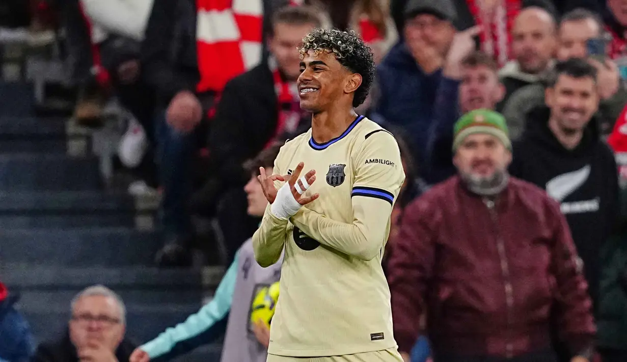 Di menit ke-68, Barcelona memecah kebuntuan setelah Lamine Yamal melepaskan tembakan melengkung dari sisi kanan dalam kotak penalti Athletic Bilbao dan berbuah menjadi gol. Barcelona unggul 0-1 atas tuan rumah. Tampak dalam foto, pemain Barcelona, Lamine Yamal merayakan golnya pada pertandingan pekan ke-27 La Liga 2025/2026 melawan Athletic Bilbao di Stadion San Mames, Sabtu 7 Maret 2026 waktu setempat atau Minggu (8/3/2026) dini hari WIB. (AP Photo/Miguel Oses)