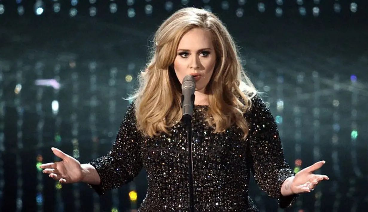 Beberapa bulan lalu Adele mengumumkan pembatakan konsernya yang semula dijadwalkan digelar pada bulan Juli lalu di Stadion Wembler, London. Hal ini dikarenakan adanya masalah dengan pita suara Adele. (AFP/Kevin Winter)