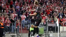 Bintang Bayern Munchen, Harry Kane, melakukan selebrasi setelah mencetak gol  dalam pertandingan Bundesliga antara Bayern Munchen dan Union Berlin di Munchen, Jerman, Sabtu (19/9/2026) dini hari WIB. (Alexandra Beier/AFP)