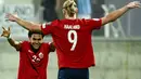 Penyerang Norwegia #09 Erling Braut Haaland (kanan) merayakan gol ke gawang Siprus bersama Antonio Nusa (kiri) yang memberikan assist dalam laga lanjutan Kualifikasi Euro 2024 Grup A di AEK Arena, Larnaca, Jumat (13/10/2023) dini hari WIB. (Jewel SAMAD / AFP)