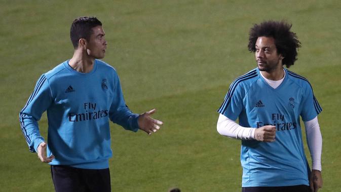 Cristiano Ronaldo dan Marcelo saat masih di Real Madrid. (AP/Hassan Ammar)