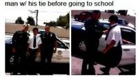 Seorang polisi yang berdinas menyempatkan diri menolong seorang pelajar yang kesulitan memasang dasi.
