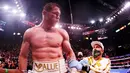 Canelo Alvarez - Atlet berusia 31 tahun ini menjelma menjadi petinju kelas dunia dengan sederet prestasi yang fantastis. Penghasilan Canelo Alvarez mencapai 444 ribu dollar per menitnya. Atau jika dirupiahkan senilai Rp6,35 miliar setiap 60 detiknya. (AFP/Al Bello)