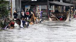 Beberapa wilayah yang terdampak banjir, di antaranya berada di Kabupaten Jembrana, Gianyar, Tabanan, Klungkung dan Kota Denpasar. (SONNY TUMBELAKA/AFP)