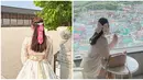 Begini tatanan rambut cantik Callista Arum ketika berkunjung ke Gyeongbokgung Palace dan Gamcheon Culture Village. Sama-sama dengan gaya ikat tengah, namun yang berbeda hanya aksesori rambut yang dikenakan. Ketika ke Gyeongbokgung Palace, Callista cantik dengan jepitan yang terdapat gambar khas Korea, sementara ketika ke Gamcheon Culture Village Callista mengenakan jepitan pita. (Liputan6.com/IG/@callistarum)