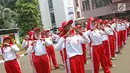 Sejumlah calon anggota Pasukan Pengibar Bendera (Paskibra) Nasional 2019 meneriakkan yel usai mengikuti latihan di PPPON Cibubur, Jakarta, Selasa (30/7/2019). Saat ini, 68 orang anggota Paskibraka nasional 2019 sedang menjalani pendidikan dan pelatihan intensif. (Liputan6.com/Herman Zakharia)