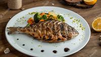 Ilustrasi ikan nila bakar, resep, masakan. (Photo by KamranAydinov on Freepik)