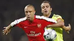 Arsenal's Mikael Silvestre holds off a challenge from Fenerbahce's Semih Senturk during Champions League Group G match at The Emirates Stadium in London on November 5, 2008. AFP PHOTO/Adrian Dennis 