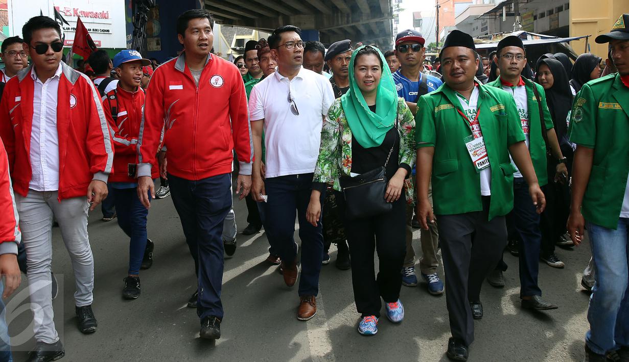 Ketum TMP, Maruarar Sirait, Wali Kota Bandung Ridwan Kamil dan Direktur Wahid Foundation Yenny Wahid saatmenghadiri acara Kirab Kebangsaan 'Bersatu Kita Teguh' Subang, Jawa Barat, Sabtu (4/3). (LIputan6.com/Johan Tallo)