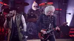Drummer band rock Queen Roger Taylor (tengah), gitaris Brian May, dan vokalis Adam Lambert (kiri) tampil di atas panggung saat konser tur Eropa Queen dan Adam Lambert di Bologna, Italia, 11 Juli 2022. Queen dan Adam Lambert saat ini sedang dalam tur Eropa. (Michele Nucci/LaPresse via AP)