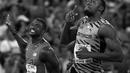 Ekspresi Usain Bolt (kanan) setelah memenangi lari 100m putra Kejuaraan Dunia Atletik 2015 di Stadion Nasional, Beijing, Tiongkok. (23/8/2015). (AFP Photo/Adrian Dennis)