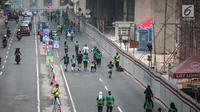 Pemandangan saat sejumlah peserta mengikuti lomba lari Milo Jakarta International 10K di kawasan Rasuna Epicentrum, Jakarta, Minggu (14/7/2019). Milo Jakarta International 10K diikuti oleh sekitar 16 ribu peserta. (Liputan6.com/Faizal Fanani)
