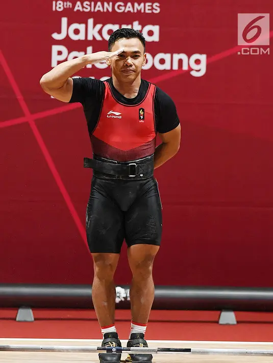 Eko Yuli mnambah emas kelima di Asian Games 2018, setelah menjadi juara di kelas 62 kilogram putra dan meraih medali emas dengan total angkatan 311 kilogram. (merdeka.com/Imam Buhori)