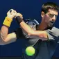 Aksi Novak Djokovic di Australia Open (PAUL CROCK / AFP)