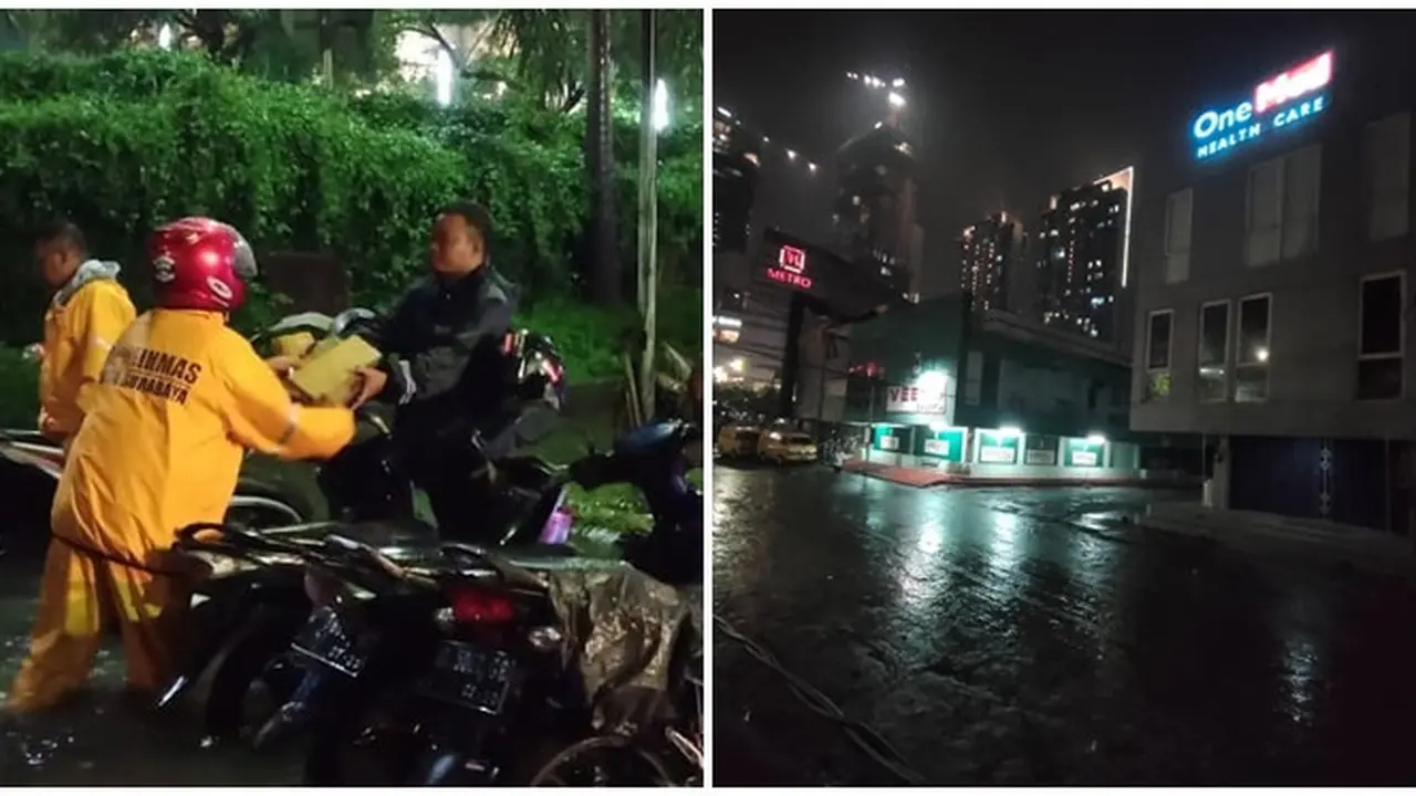 Petugas Bantu Bersihkan Saluran di Kota Surabaya