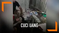 Beredar video sejumlah anggota TNI sedang mencuci dan mengeringkan uang setelah bencana banjir bandang menerjang Sentani.