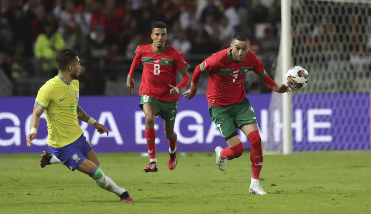 Adalah Sofiane Boufal (29’) dan Abdelhamid Sabiri (79’) yang menjadi pencetak gol kemenangan Timnas Maroko, sementara satu gol Brasil dibukukan Casemiro (67’). (AP Photo/Mosa'ab Elshamy)