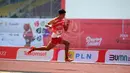 Saptoyogo Purnomo pelari 200 meter putra kelas T37 meraih medali emas pada ASEAN Para Games 2022 di Stadion Manahan Solo, 2 Agustus 2022. (Foto: Dok. ASEAN Para Sports Federation)