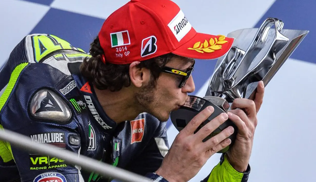 Legenda hidup MotoGP, Valentino Rossi harus puas menempati tempat ketiga pada balapan yang digelar di Sirkuit Mugello, Italia, (1/6/2014). (AFP PHOTO/Andreas Solaro)