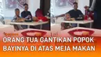 Aksi orang tua gantikan popok bayinya di atas meja makan mengundang perhatian