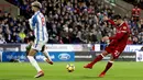 Pemain Liverpool, Emre Can berhasil mencetak gol ke gawang Huddersfield Town pada pertandingan pekan ke-25 Premier League di John Smith's Stadium, Selasa (30/1). Liverpool menang telak tiga gol tanpa balas. (Martin Rickett/PA via AP)