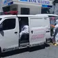 Penanganan pasien Covid-19 yang meninggal dunia di RS Pancaran Kasih Manado, Sulut, pada awal Juni 2020 lalu.