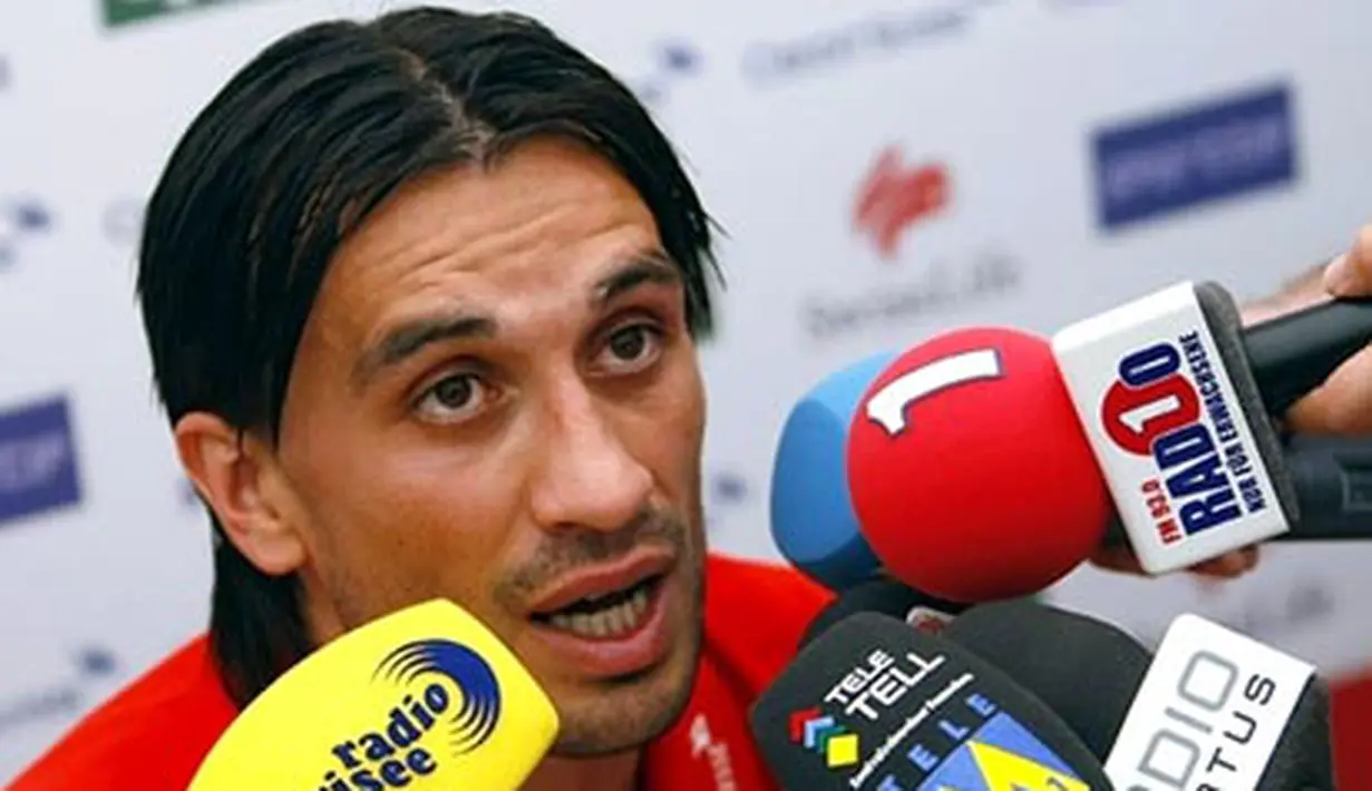 Swiss midfielder Hakan Yakin answers journalist's questions during a press conference at Feusisberg on June 03, 2008, ahead of the Euro 2008 Football Championships co-hosted by Austria and Switzerland. AFP PHOTO / Olivier MORIN