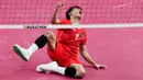 <p>Indonesia lalu merebut gold medal point di angka 20-13. Smes Rusdi yang tak bisa dikembalikan akhirnya memastikan kemenangan Indonesia di laga final. (AP Photo/Tatan Syuflana)</p>