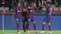 Barcelona meraih kemenangan 2-0 atas Real Sociedad pada laga pekan ke-35 La Liga di Estadi Olimpic Lluis Companys, Barcelona, Selasa (14/5/2024) dini hari WIB. Sepasang gol Barca dicetak Lamine Yamal dan Raphinha. (AFP/Lluis Gene)&nbsp;