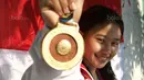 Atlet Senam Artistik, Rifda Irfanaluthfi meraih emas pada senam artistik nomor balok keseimbangan di MATRADE Exhibition and Convention Centre, Segambut, Rabu (23/8/2017). Rifda meraih nilai total 13. (Bola.com/Nicklas Hanoatubun)
