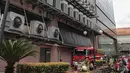 Suasana Gedung Kementerian Hukum dan Hak Asasi Manusia Republik Indonesia (Kemenkumham) seusai peristiwa kebakaran di Jalan Rasuna Said, Kuningan Jaksel, Kamis (8/12/2022). Penyebab kebakaran sebuah ruangan di lantai 5 Gedung Kemenkumham diduga akibat hubungan arus pendek listrik. (Liputan6.com/Faizal Fanani)