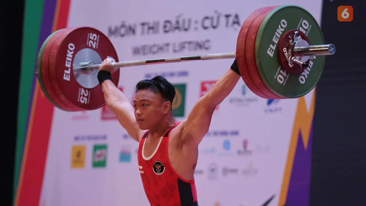 Foto: Tampil Percaya Diri, Rahmat Erwin Abdullah Rebut Emas Angkat Besi di Kelas 73 kg Putra sekaligus Pecahkan Rekor SEA Games