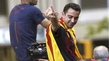 Xavi Hernandez saat melakukan selebrasi usai membawa Barcelona menjuarai Liga Champions 2014-2015. Xavi menuduh kalangan media tak adil dalam pemberitaan terkait masalah pajak Lionel Messi.  (EPA/Alejandro Garcia)