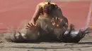 Atlet Atletik Long Jump Women kelas 11-12 Yuliana Wouw Wouw asal Papua melakukan lompatan saat pertandingan final Peparnas XVII di Stadion Sriwedari, Solo, Jawa Tengah, Selasa (8/10/2024). Yuliana Wouw Wouw mendapatkan medali emas di kelas 11-12. (PB PEPARNAS XVII/Feira Manbud)