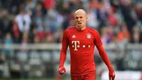 Arjen Robben memntahkan rumor kepindahannya ke Manchester United karena ingin menghormati kontraknya bersama Bayern Munchen. (AFP/CHRISTOF STACHE)