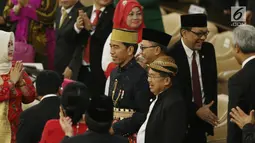 Presiden Joko Widodo (Jokowi) dan Wakil Presiden Jusuf Kalla pada Sidang Tahunan MPR di kompleks Parlemen, Senayan, Jakarta, Rabu (16/8). Sidang tersebut beragendakan mendengar pidato Presiden Joko Widodo selaku Kepala Negara. (Liputan6.com/Johan Tallo)